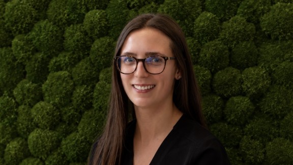 Woman in front of green background