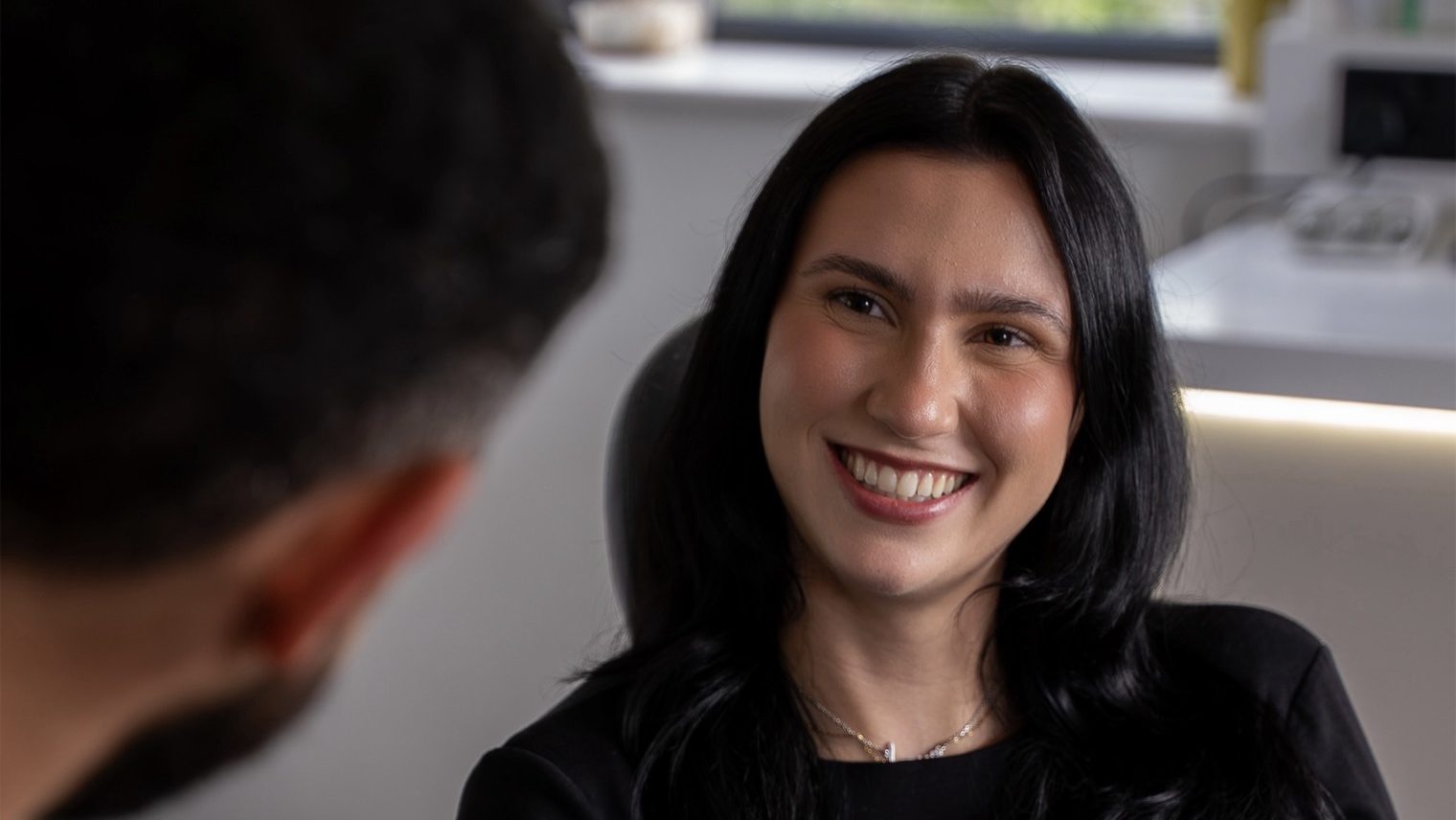 a female patient smiling