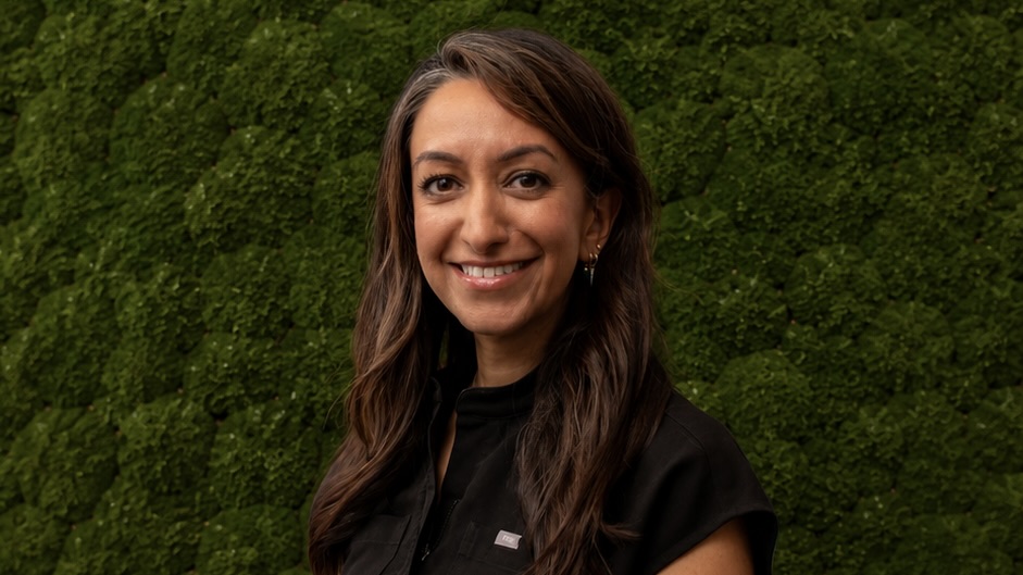 Woman in front of green background