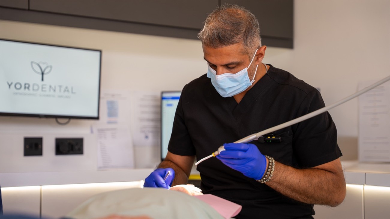 Hitesh Panchal performing a procedure on a patient