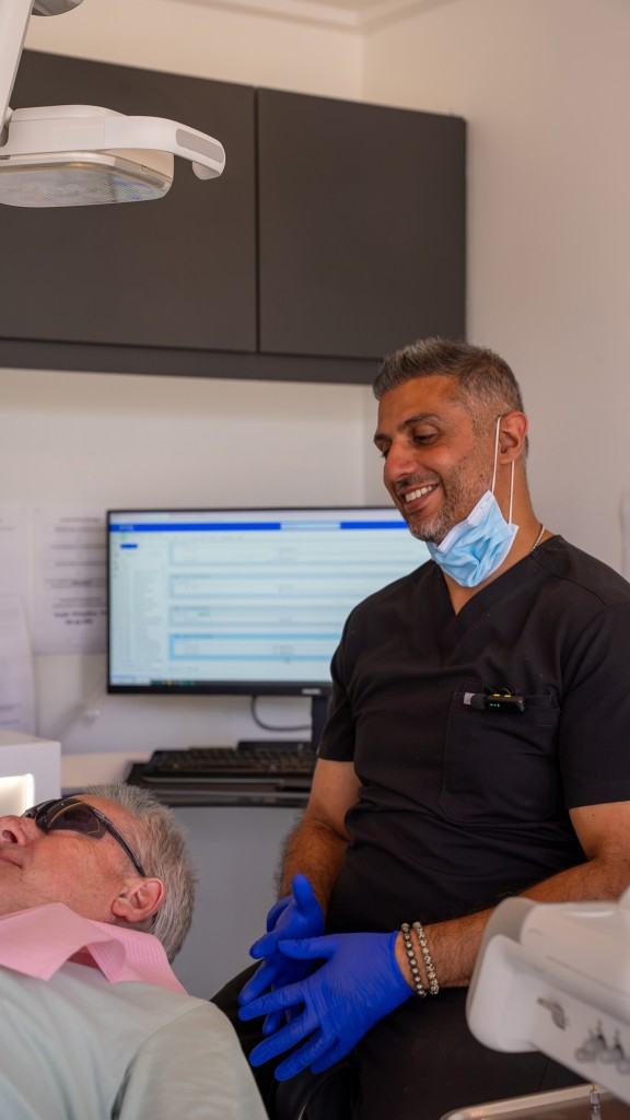 a male dentist and a male patient