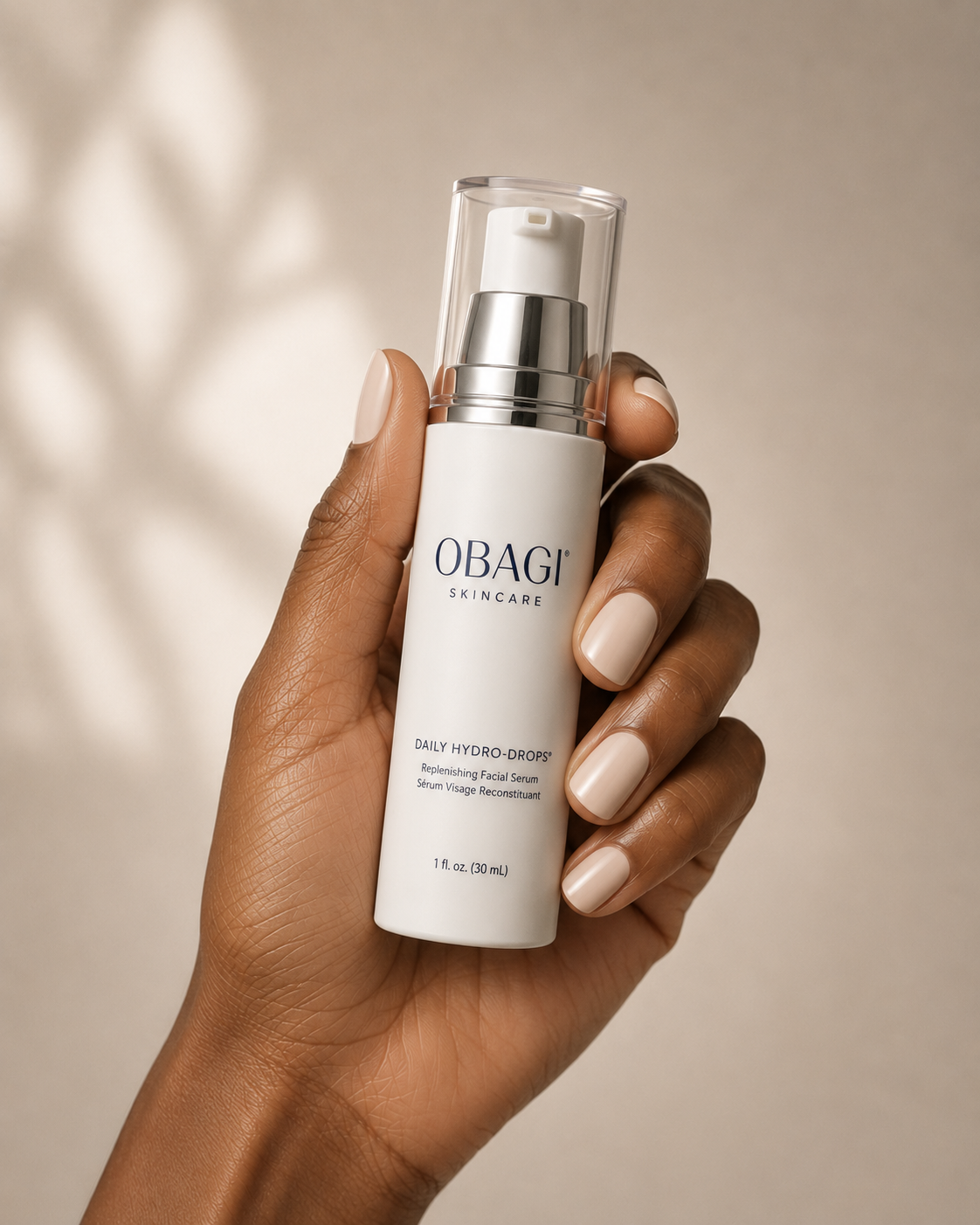 Person holding the 'daily hydro-drops' product