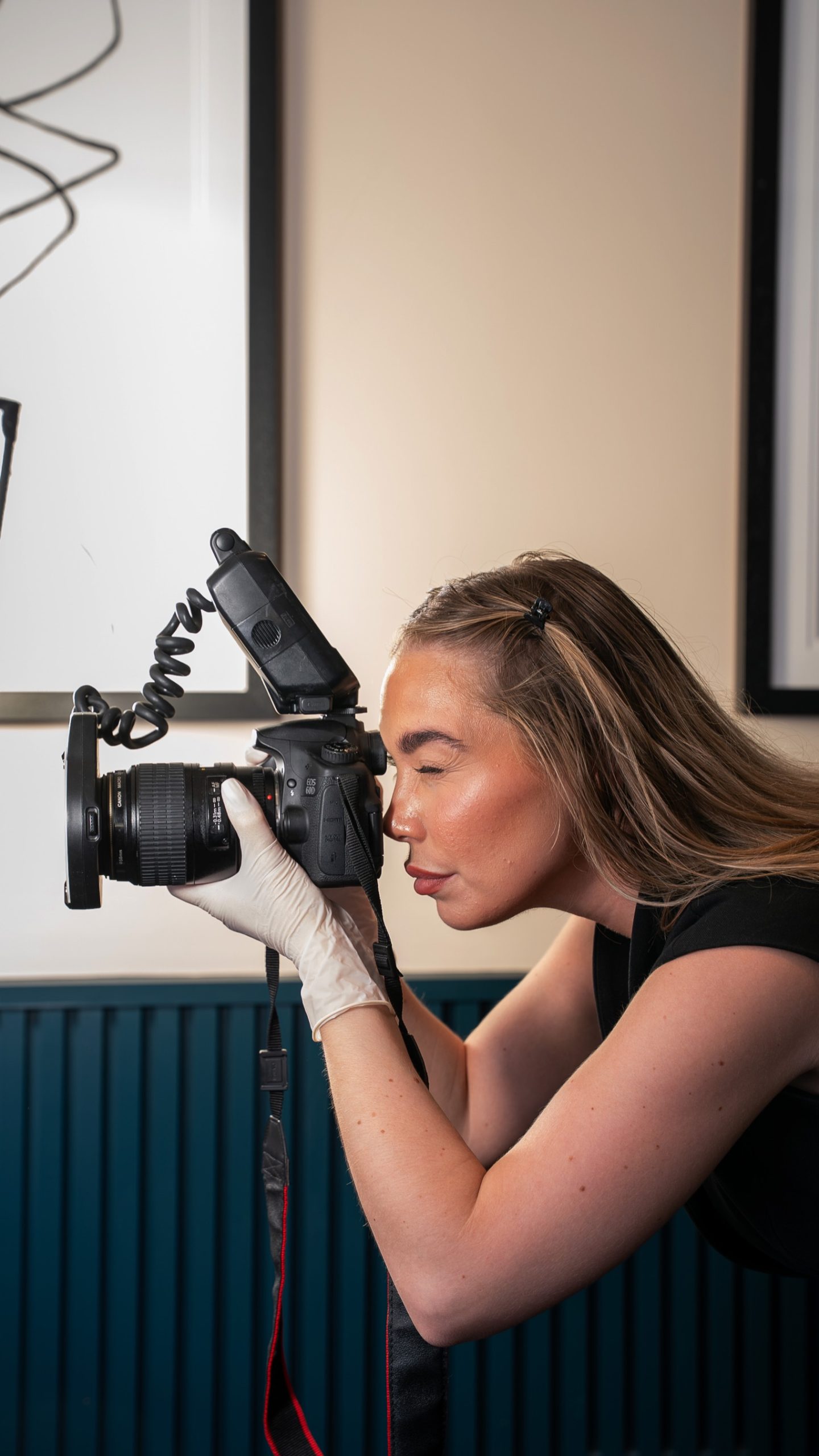 a woman leaning down and taking a photo with a camera